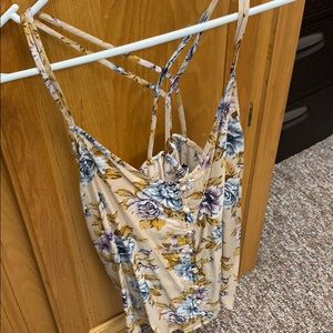 Floral tank with buttons going down